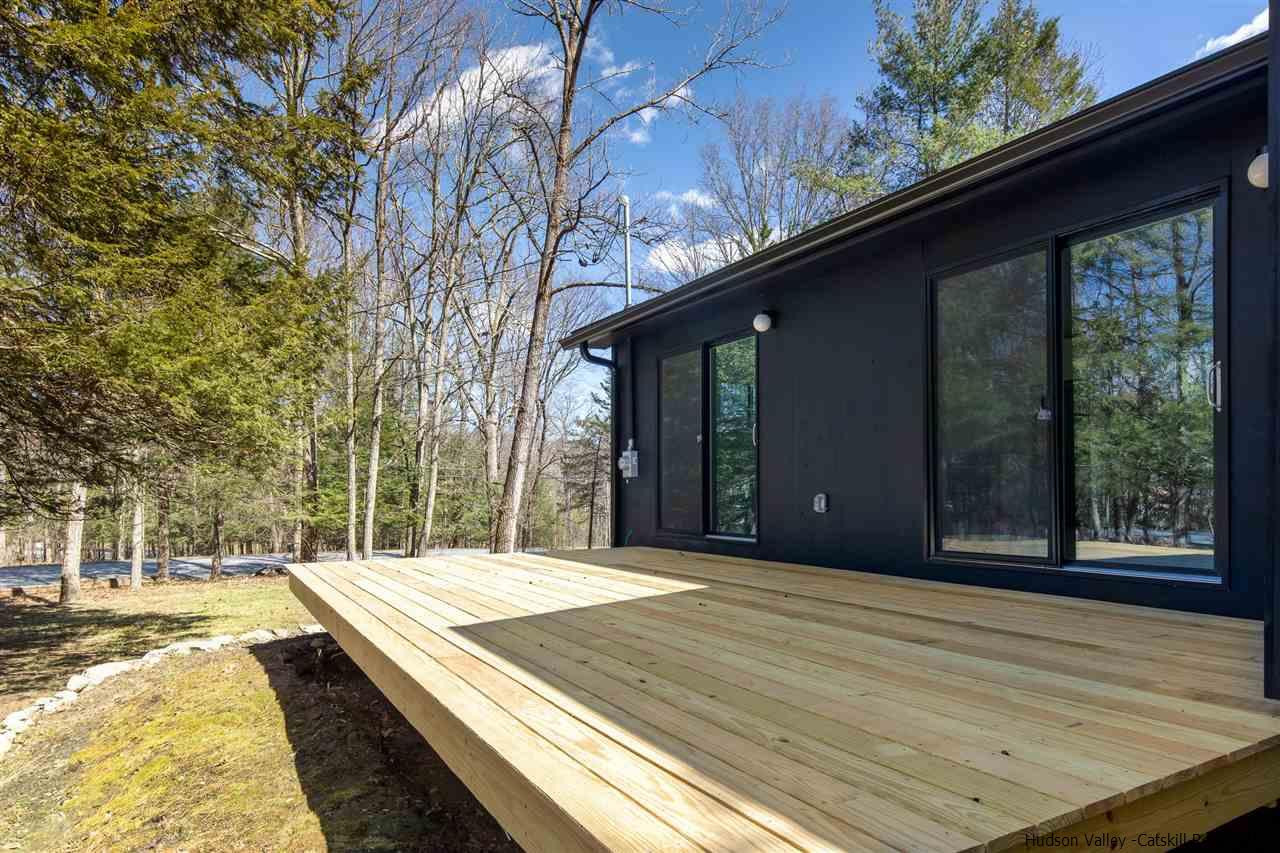 25 Upper Cherrytown Road Kerhonkson, NY 12446 - Photo 10 of 14 a view of backyard with large trees and wooden fence
