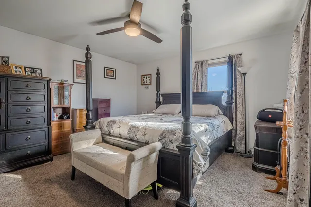 a bedroom with a bed and furniture