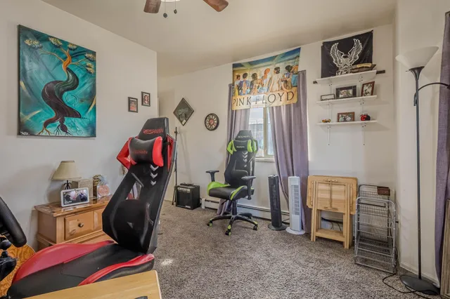 a view of a workspace with furniture and toys