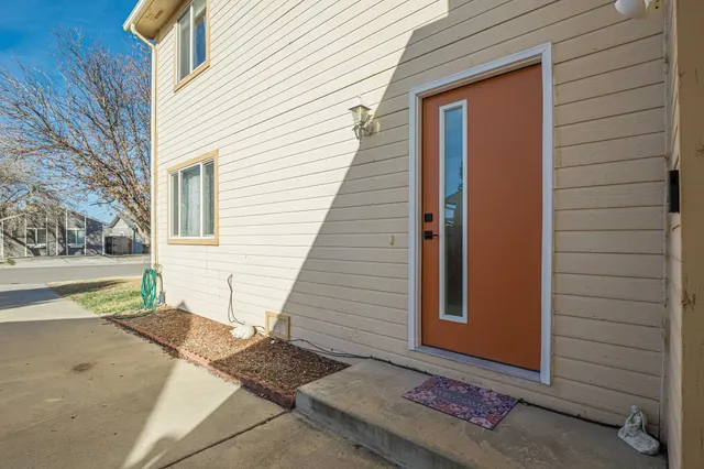a view of a door and a window