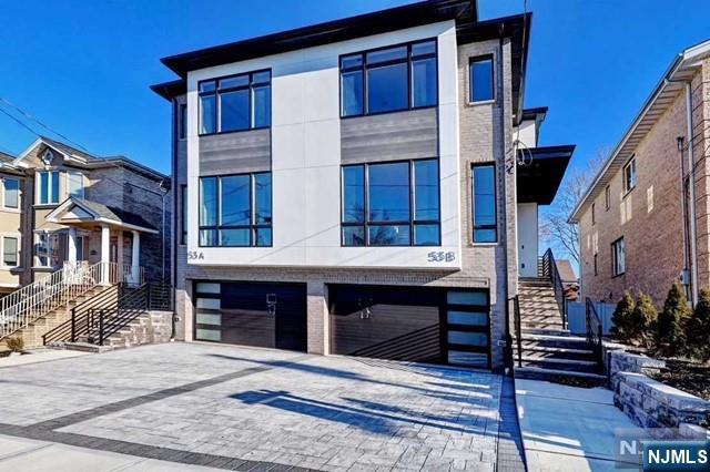53 West Columbia Avenue, Unit A Palisades Park, NJ 07650 - Photo 1 of 22 a view of a house with a balcony and stairs