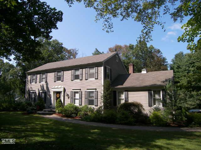 11 Obtuse Road North Brookfield, CT 06804 - Photo 1 of 1 a front view of a house with a yard table and chairs