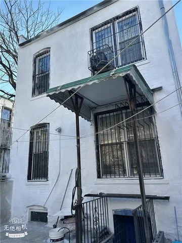 a view of entryway and gallery with wooden floor