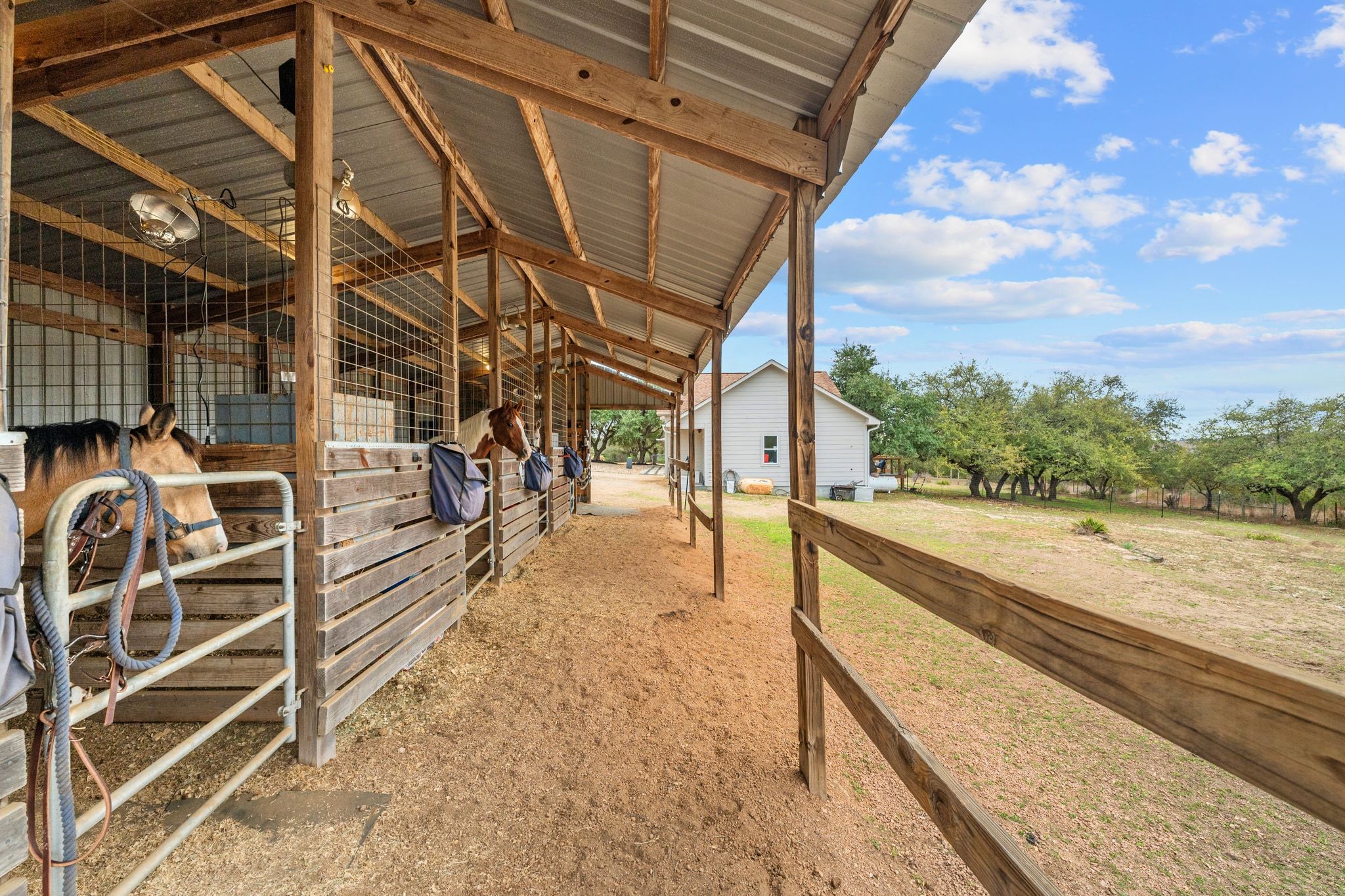 401 Ranchview Drive Johnson City, TX 78636 - Photo 12 of 40 solid metal roof on the stables
