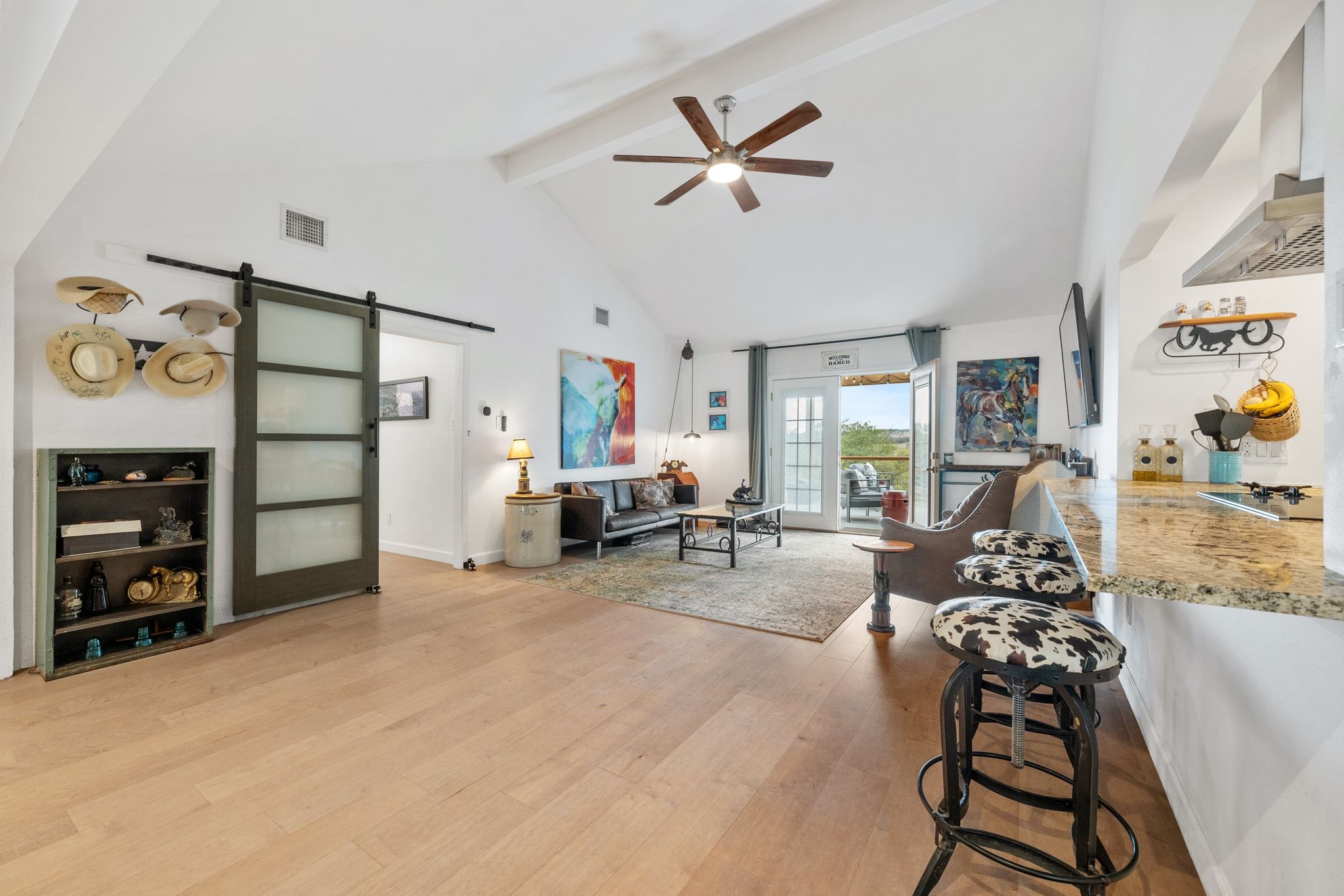 401 Ranchview Drive Johnson City, TX 78636 - Photo 14 of 40 Glass barn doors w iron railing open to the kitchen