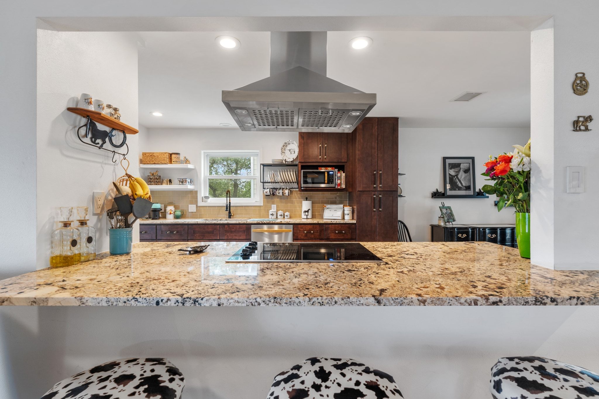 401 Ranchview Drive Johnson City, TX 78636 - Photo 20 of 40 Kitchen with island exhaust hood, light stone counters, decorative backsplash, a peninsula, and recessed lighting