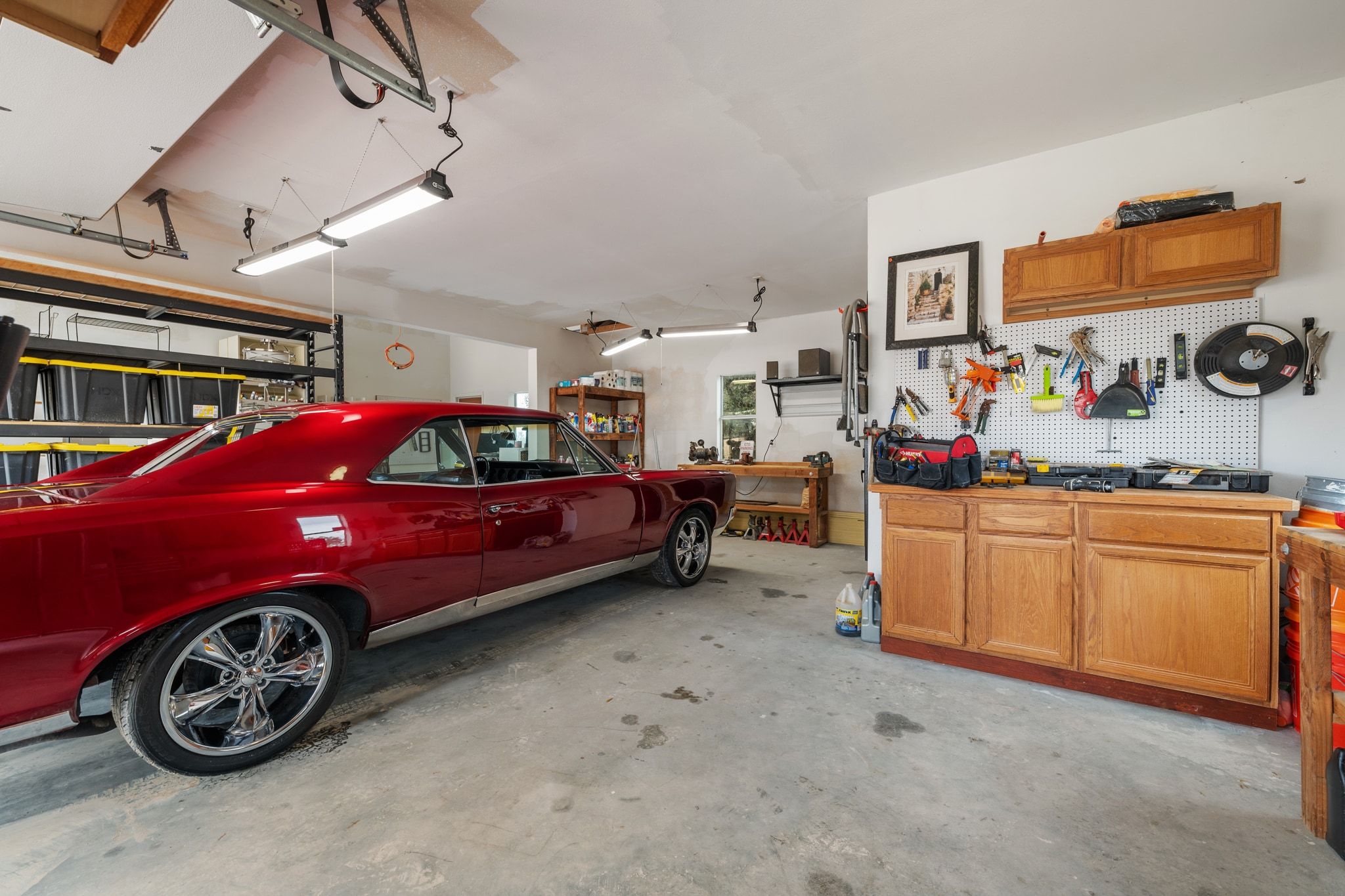 401 Ranchview Drive Johnson City, TX 78636 - Photo 30 of 40 Garage featuring a workshop area