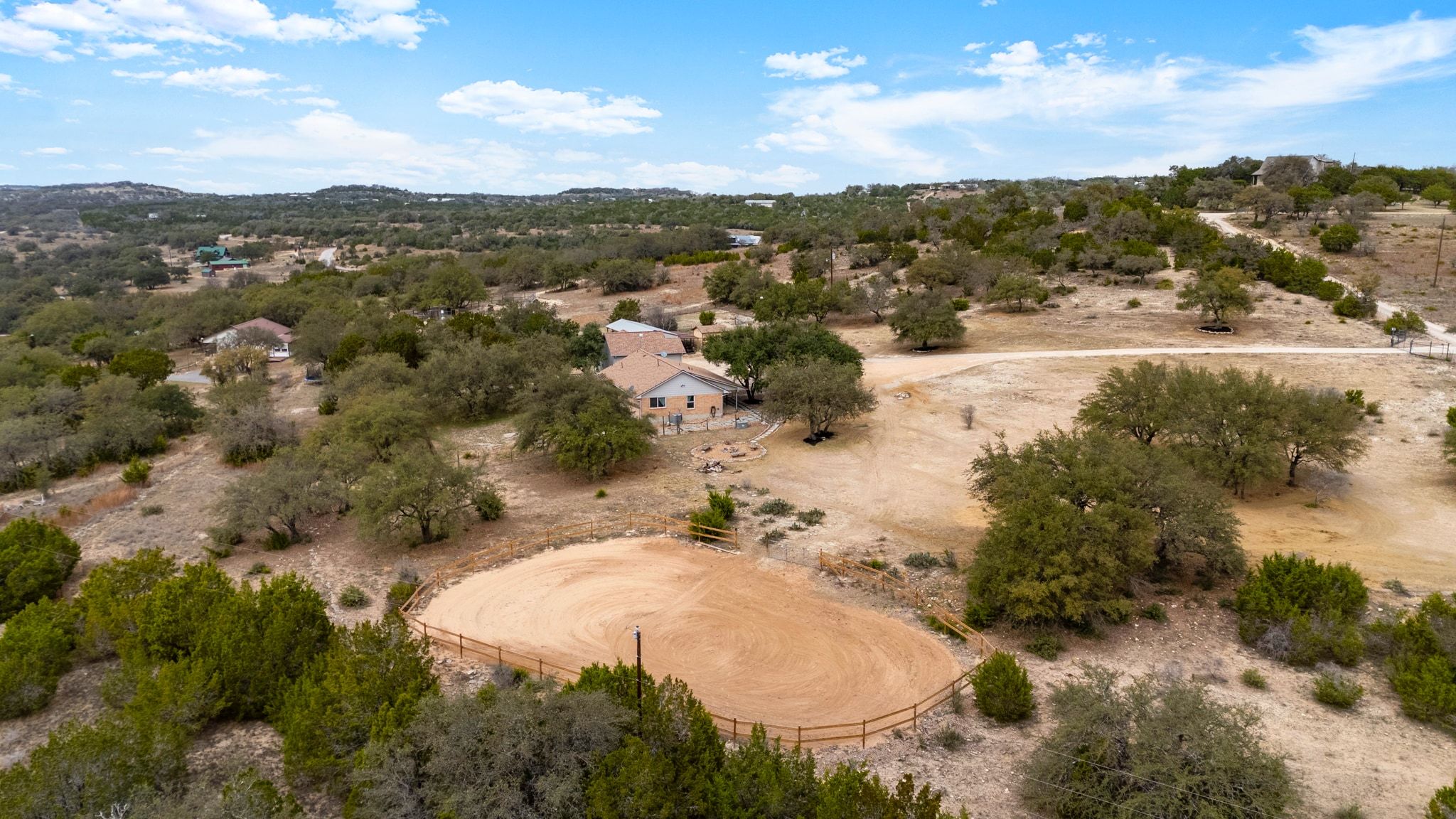 401 Ranchview Drive Johnson City, TX 78636 - Photo 37 of 40 Ariel view of the property layout and arena