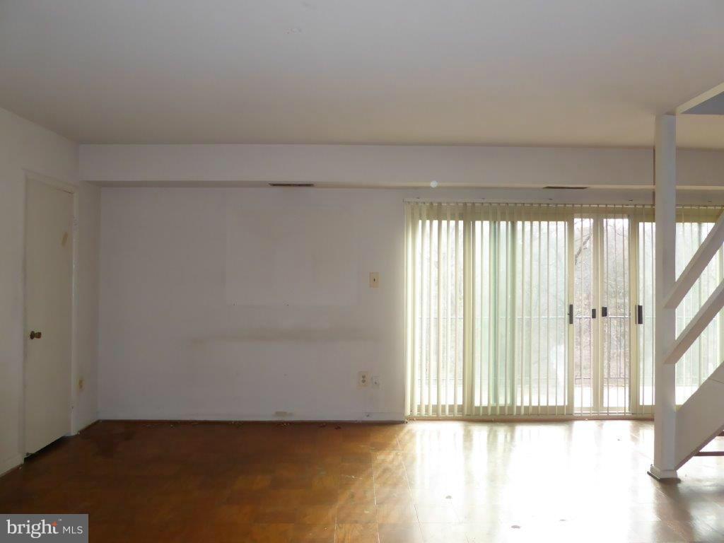 8706 Manchester Road, Unit 6 Silver Spring, MD 20901 - Photo 3 of 12 a view of a room with wooden floor and windows