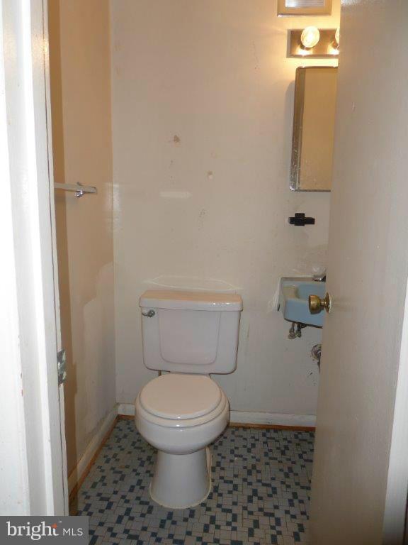 8706 Manchester Road, Unit 6 Silver Spring, MD 20901 - Photo 5 of 12 a bathroom with a toilet