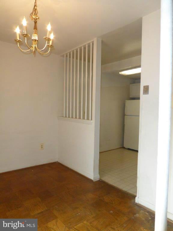 8706 Manchester Road, Unit 6 Silver Spring, MD 20901 - Photo 7 of 12 a view of empty room with wooden floor