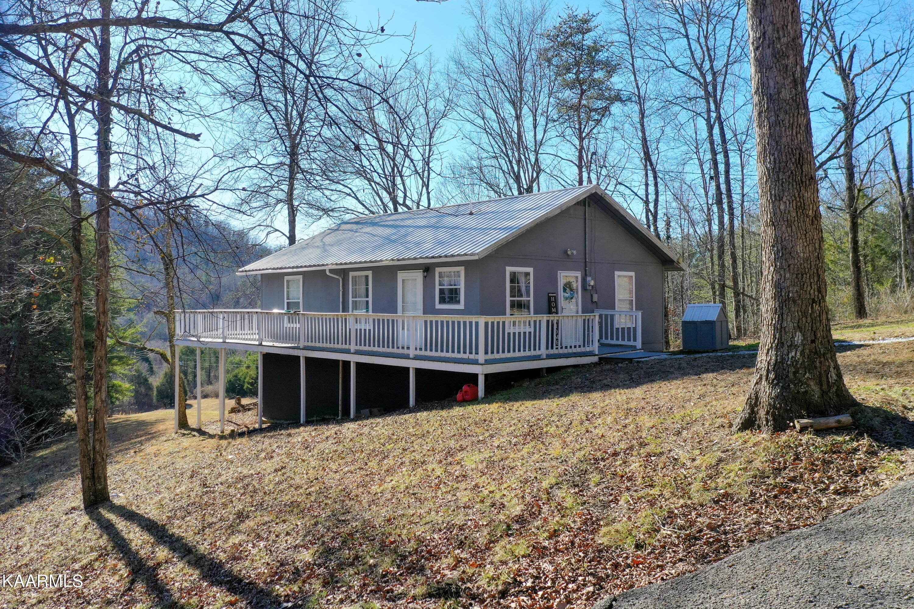 1495 Reagan Valley Road Tellico Plains, TN 37385 - Photo 2 of 26 Partial wraparound porch