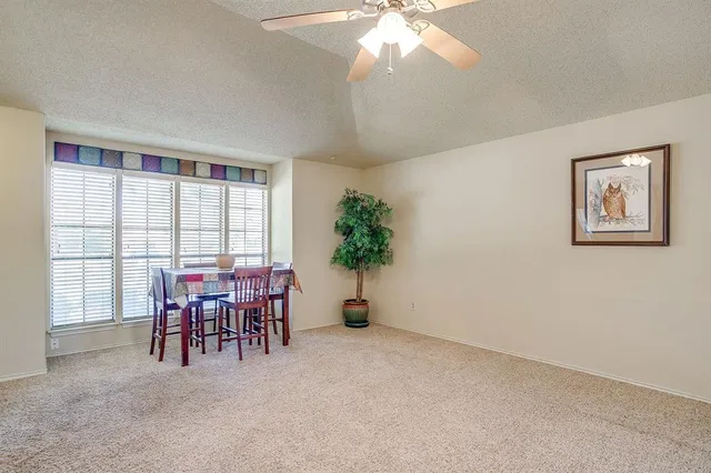 a view of a livingroom with furniture and window