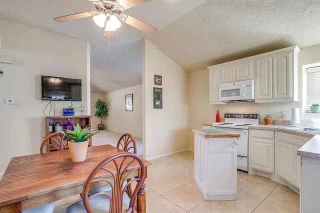 a view of kitchen with cabinets and outdoor space