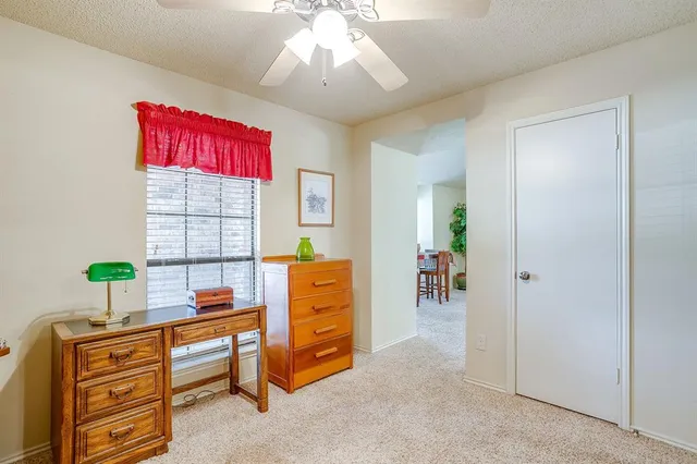 a workspace with furniture and window
