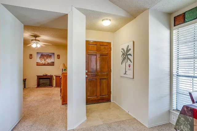 a view of a livingroom with furniture and cabinet