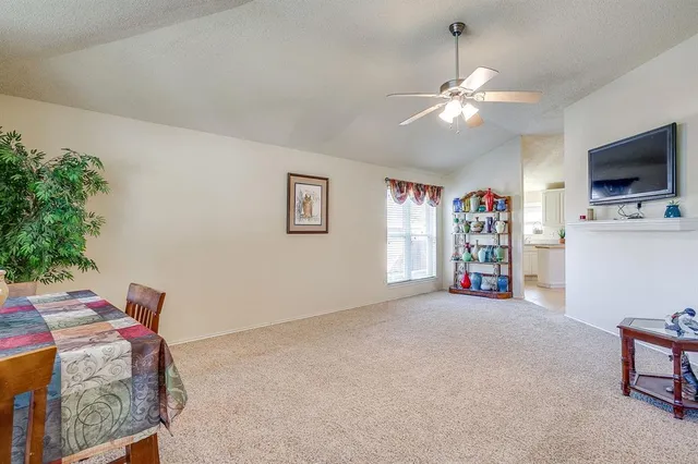 a bedroom with furniture and a flat screen tv