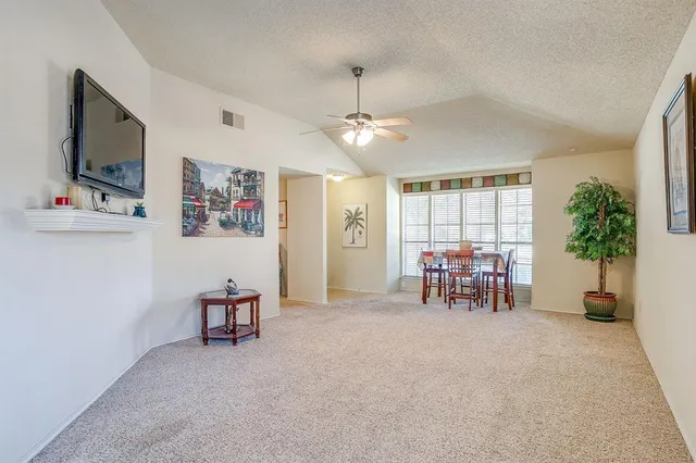 a view of a livingroom with furniture and a flat screen tv
