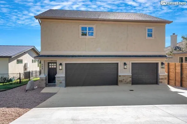 a front view of a house with garage