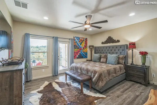 a bedroom with a large bed and a window