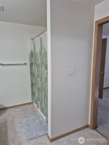 a view of outdoor space with wooden floor and windows