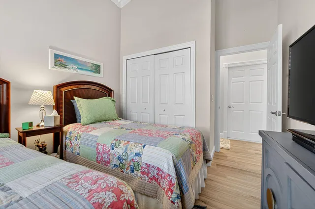 a bedroom with a bed and a flat screen tv