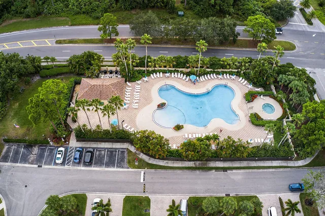 an aerial view of a house with a lake view