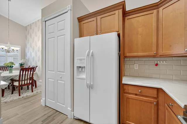 a white refrigerator freezer sitting in a kitchen