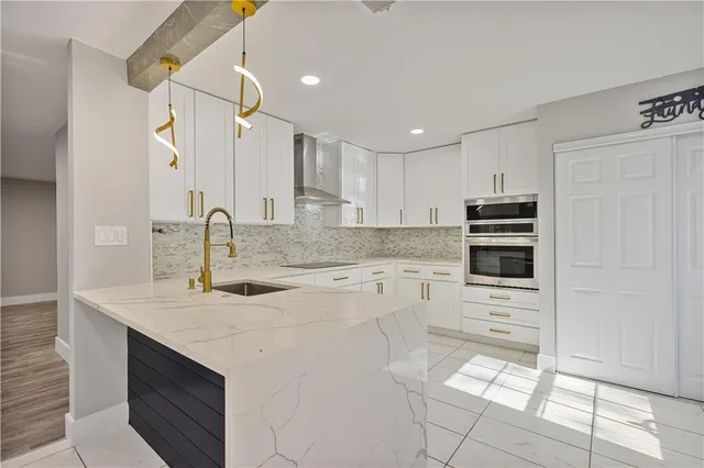 a kitchen with a sink cabinets and appliances