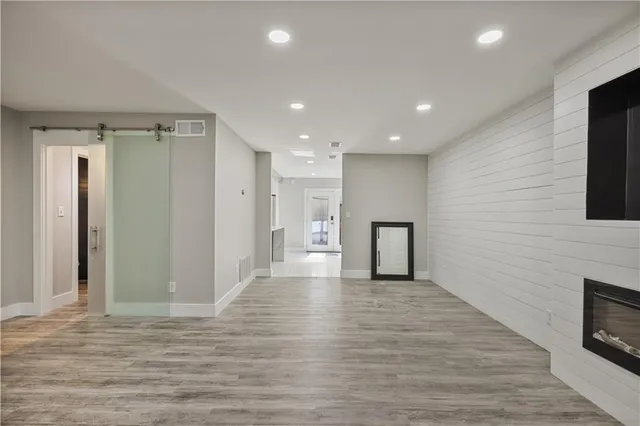 a view of a livingroom with wooden floor