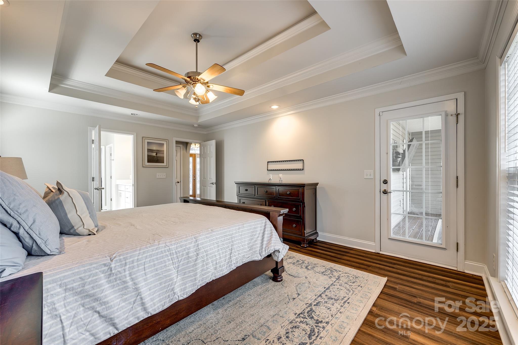 1352 North Dobys Bridge Road Fort Mill, SC 29715 - Photo 13 of 31 a spacious bedroom with a bed and a chandelier