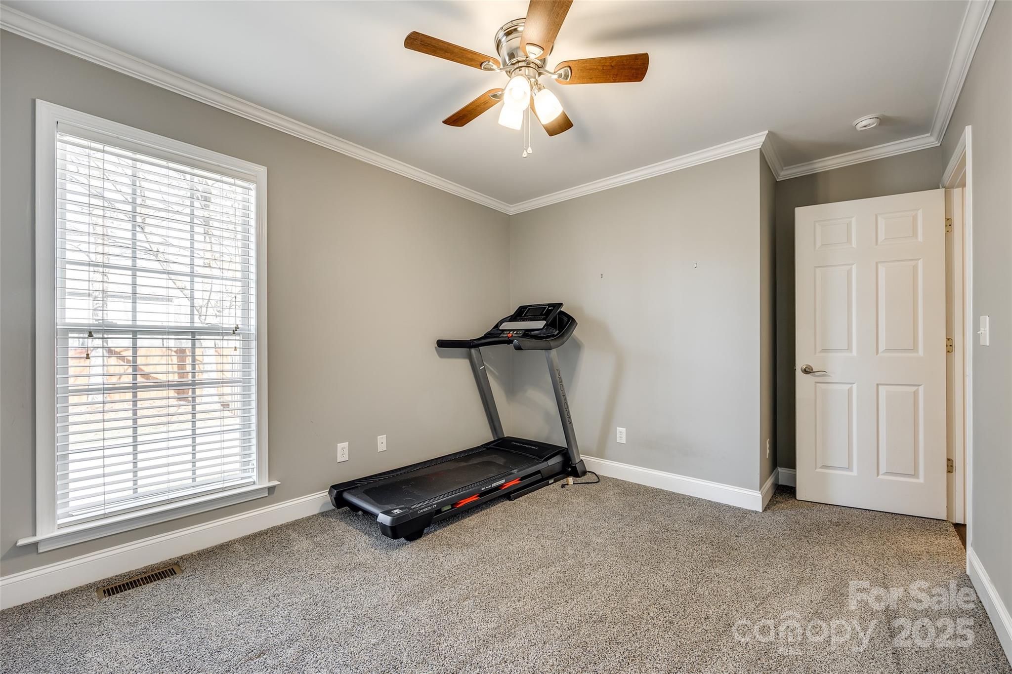 1352 North Dobys Bridge Road Fort Mill, SC 29715 - Photo 18 of 31 a room with gym equipment and a window