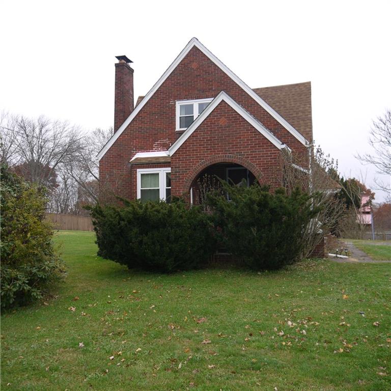 2020 Ridge Rd Extension Ambridge, PA 15003 - Photo 1 of 6 a front view of a house with garden