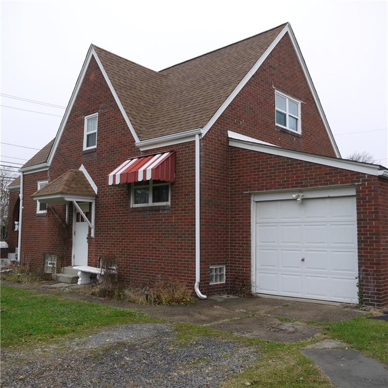 2020 Ridge Rd Extension Ambridge, PA 15003 - Photo 3 of 6 a front view of a house with a yard