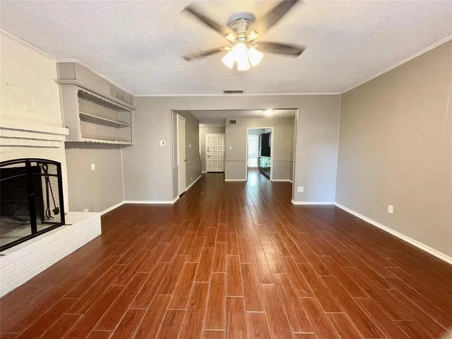 a view of a livingroom with wooden floor