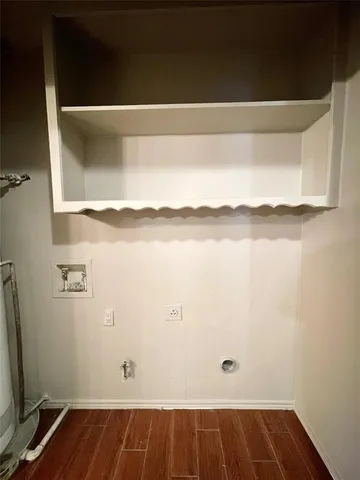 a view of a room with wooden floor