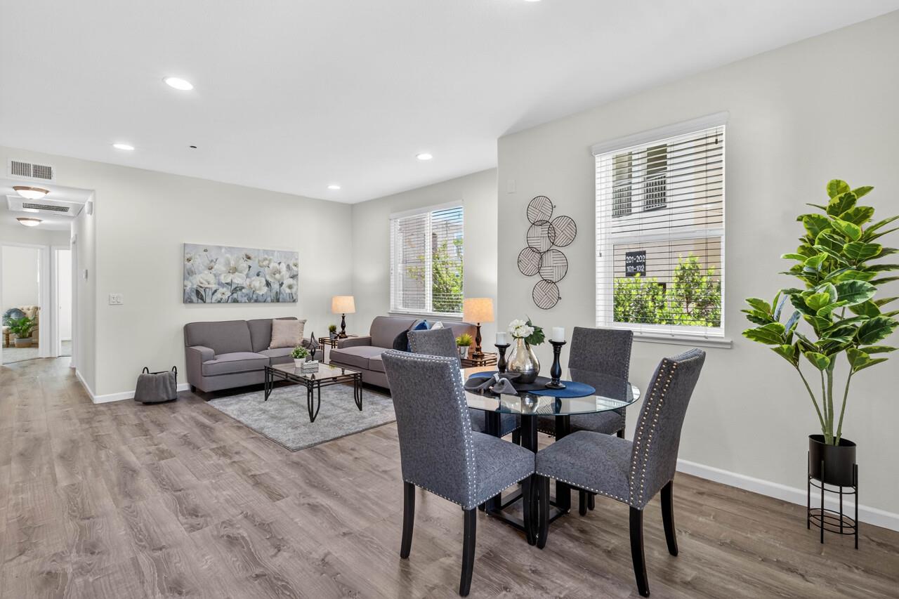 4712 Norris Canyon Road, Unit 104 San Ramon, CA 94583 - Photo 3 of 22 a living room with furniture and a potted plant