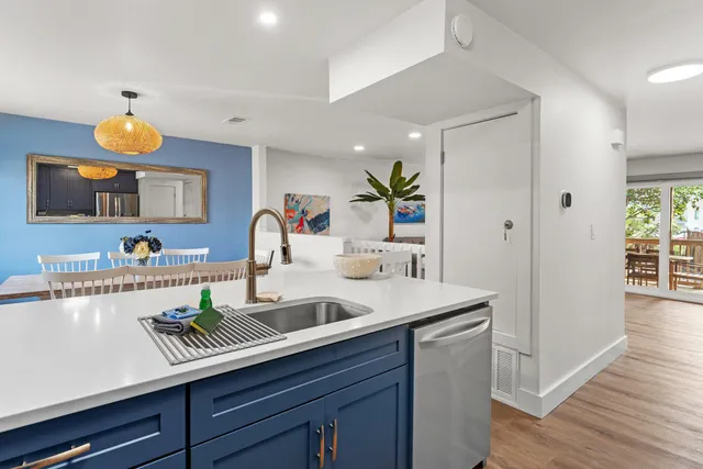 a kitchen with a sink and a refrigerator