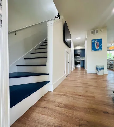 a bedroom with a bed and chair