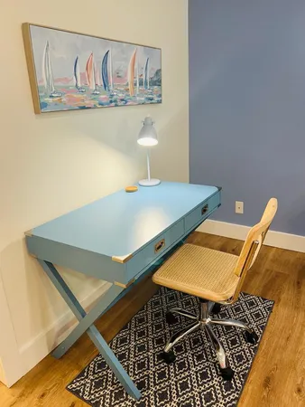 a bathroom with a double vanity sink toilet and a mirror