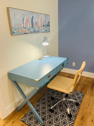 a bathroom with a double vanity sink toilet and a mirror