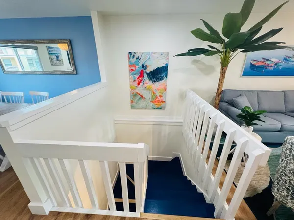 a view of an entryway with wooden floor