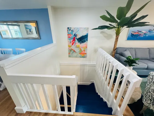 a view of an entryway with wooden floor