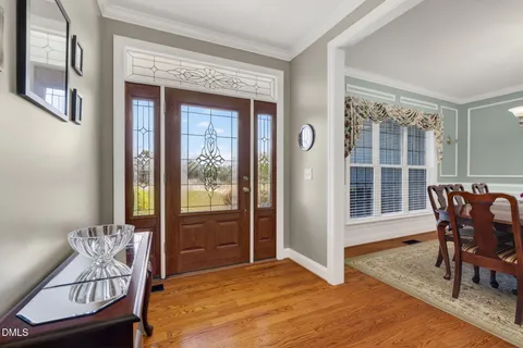 a view of livingroom with furniture flat screen tv and a fireplace