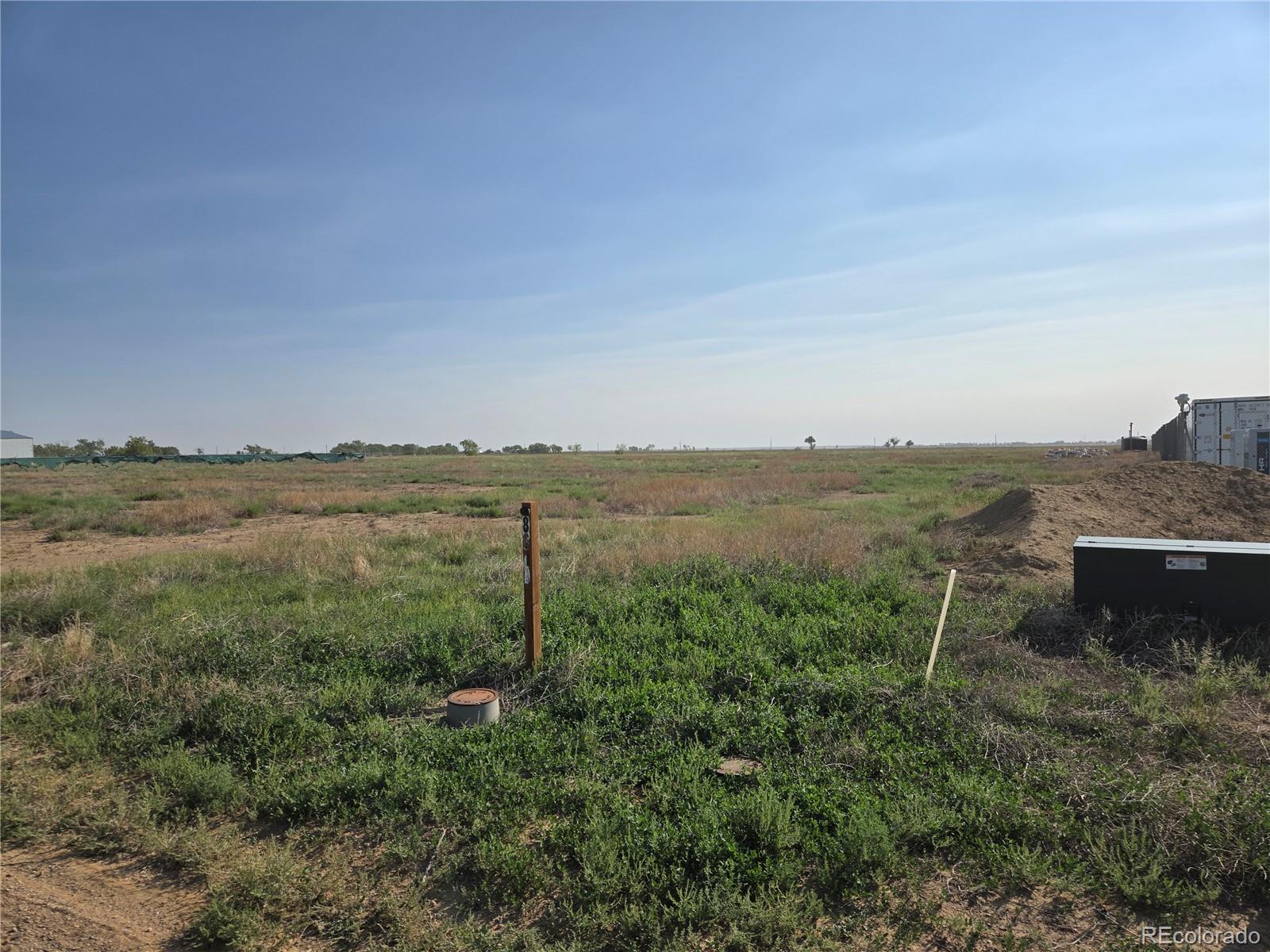 8618 Maverick Lane Ordway, CO 81063 - Photo 2 of 6 a view of a lake with mountain in the background