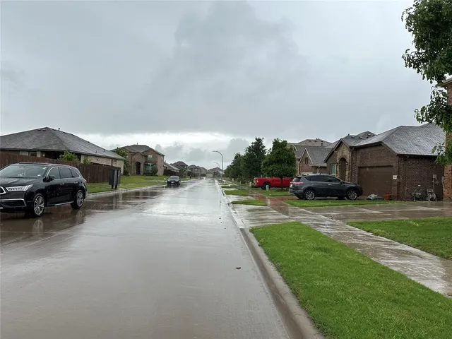 a view of a car parked in front of a house