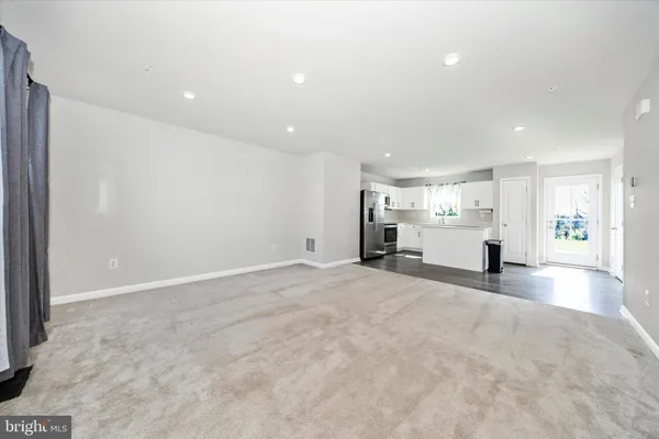 a view of a kitchen with a sink and a stove top oven