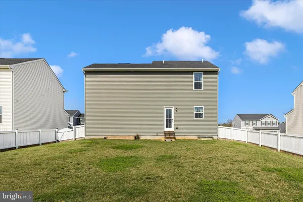 a backyard of a house with seating space