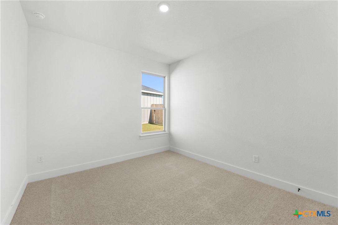 1727 Bear Grass Rdg Road Temple, TX 76501 - Photo 13 of 16 a view of an empty room and a window
