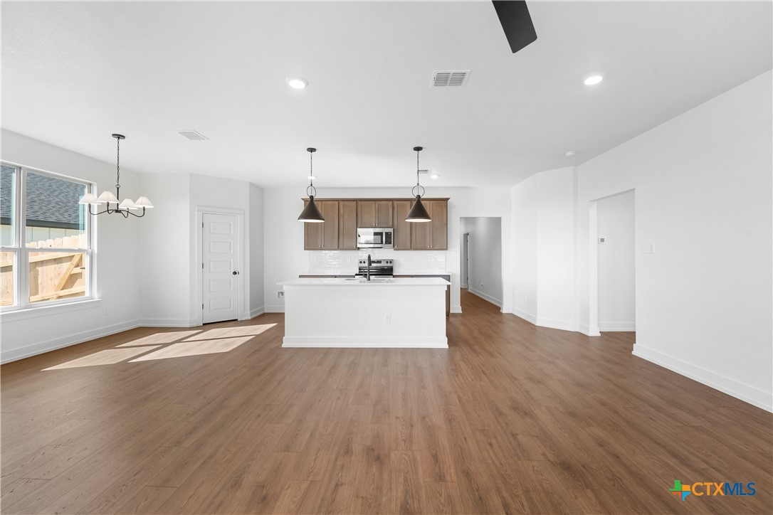 1727 Bear Grass Rdg Road Temple, TX 76501 - Photo 2 of 16 a view of a kitchen with microwave and cabinets